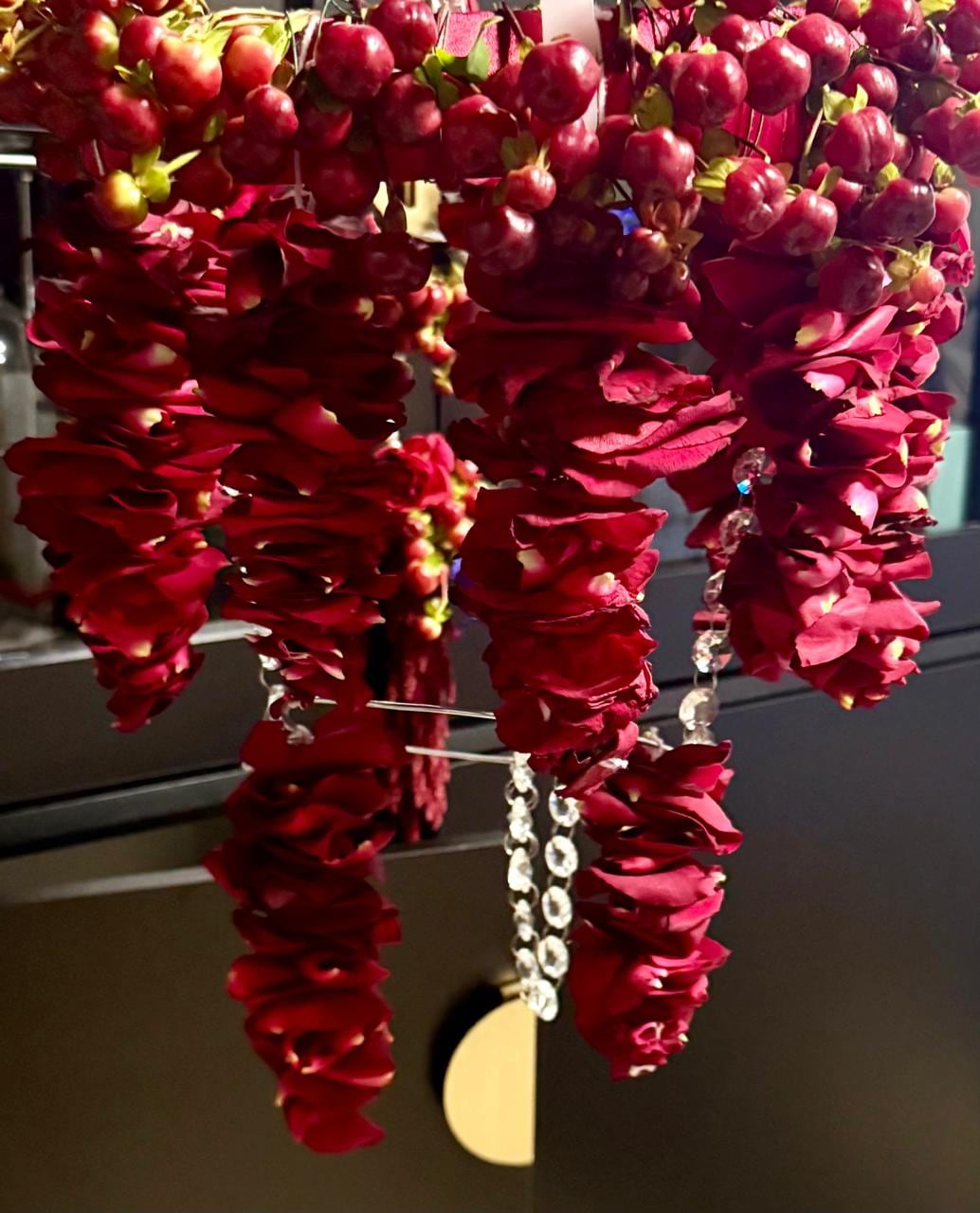Deep red orchids hung as a cascading chandelier
